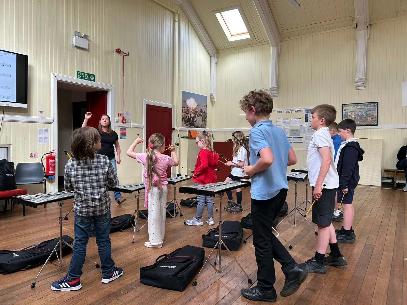 Young students learning tuned percussion with Seonaid