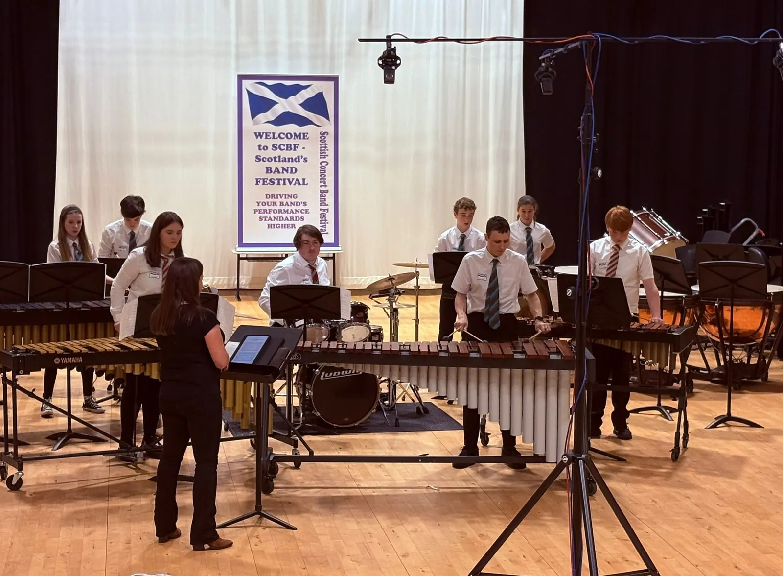 Seonaid conducting her students' percussion ensemble at the Scottish Concert Band Festival